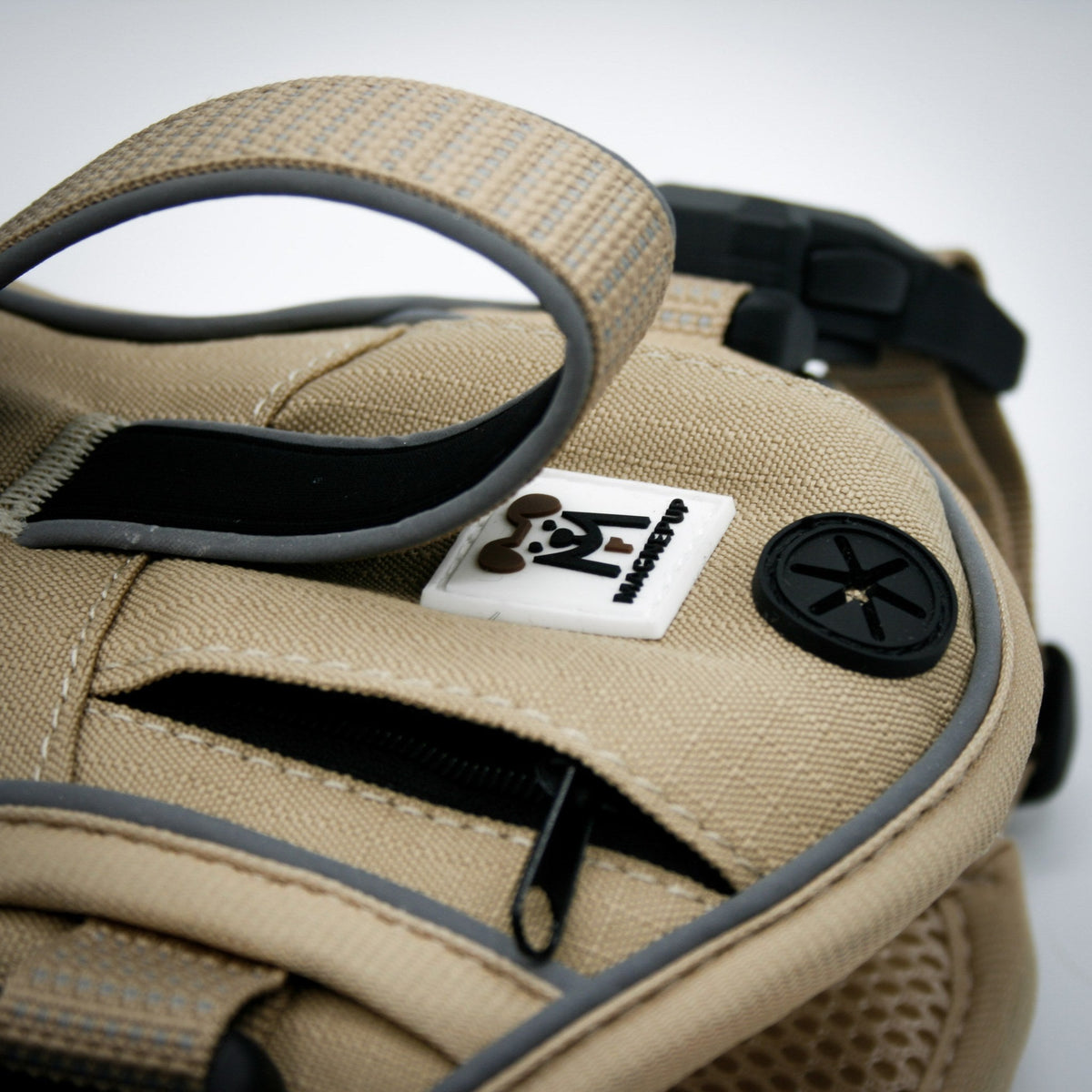 Built-in waste bag dispenser on the Desert Tan harness